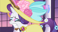 Great...Rarity got frosting on her dress and hat.