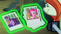 Photographer looks at Twilight and Pinkie's photos S8E13