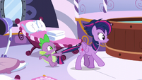 Spike holds Twilight by the tail S5E3