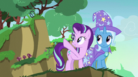 Starlight Glimmer pointing at a nearby cliff S7E17