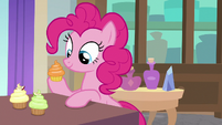 Here's Pinkie spending her time eating cupcakes.