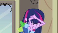 Twilight shielding herself from the student crowd EG