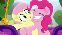 Pinkie Pie tightly hugging Fluttershy MLPRR