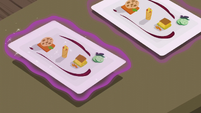 Row of fancy food trays S6E12