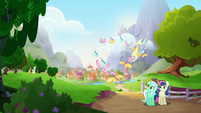 Derpy flying past Lyra and Sweetie Drops MLPRR