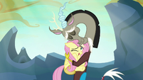Discord tightly hugging Fluttershy S6E26