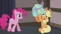 Applejack shaking Pinkie's present S5E20