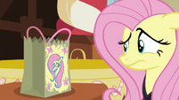 Fluttershy looking at her candy bag S5E21