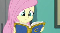 Fluttershy smiling at the yearbook EGFF