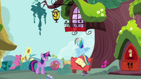 Rainbow sits on the library signboard S4E21