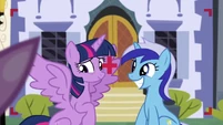 Twilight opens her wing while Minuette smiles S5E12
