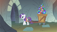 Rarity pulling a cart full of gems.