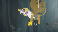 Gilda grabs onto the rock wall with her claws S5E8