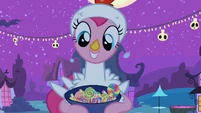 Pinkie Pie smiles at the amount of candy she has...