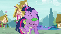 A teary-eyed Spike hugging a sad Twilight S5E3