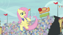 Fluttershy lightly throws the buckball S9E6