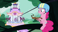 Pinkie on a tree branch holding a crossbow S5E19