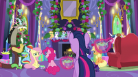 Ponies eating pudding around the fireplace MLPBGE