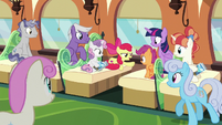 Train passengers listening to Apple Bloom S8E6