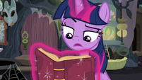 Twilight reading one of Meadowbrook's journals S7E20