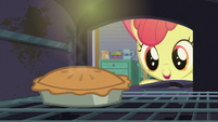 Apple Bloom opens a stove containing a pie S6E4