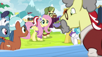 Fluttershy approaching Flim's stand MLPBGE