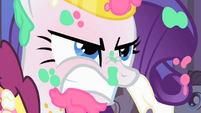 Rarity angry at Prince Blueblood for using her as a shield against the cake S1E26