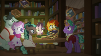 Firelight levitating a large amount of books S8E8