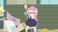 Fluttershy holding a garbage bag EG