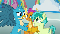 Gallus looks embarrassed at Smolder and Sandbar S8E2