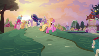 Luster Dawn trotting down the hill S9E26