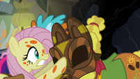 Fluttershy puts a mask on Cattail's face S7E20