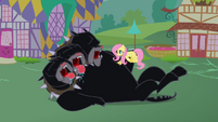 Fluttershy rubbing Cerberus' belly S2E20