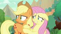 Applejack and Fluttershy looking around S8E23