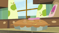 Baked pie sitting on the table S8E10