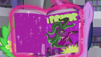 Twilight hides her face behind Mane-iac comic S9E5