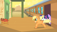 Applejack, Rarity and Twilight rushing out of the train.