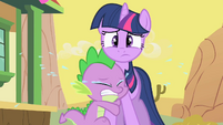 Spike hugs Twilight's leg and cries.