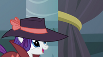 Rarity looks at the velvet rope-holder S5E15