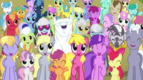 Smiling along with everypony else.