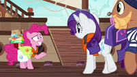 Pinkie Pie grins nervously at Rarity S6E22