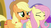 Applejack compliments Rarity's hardwork while Fluttershy nods her head S5E14