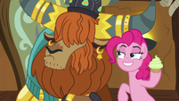 Rutherford pouts as Pinkie holds a cupcake S8E2