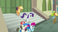 Applejack and Rarity exit the train station S5E16