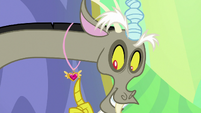 Discord looking at his medal S7E1