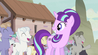 Starlight smiling at the cheering equalized ponies S5E02