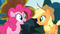 Pinkie Pie and Applejack smiling while looking at each other S4E09