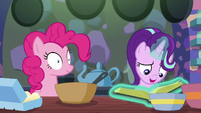 Starlight Glimmer opening the cookbook S6E21