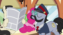 All Aboard walks past a seated Pinkie and a Don Draper-like pony S5E11