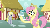 Fluttershy is scared of the paper.